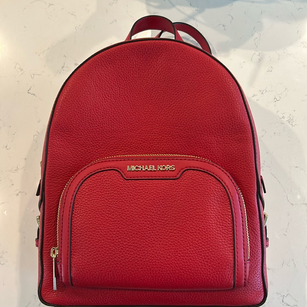 “Michael Kors medium zip backpack in bright red leather”